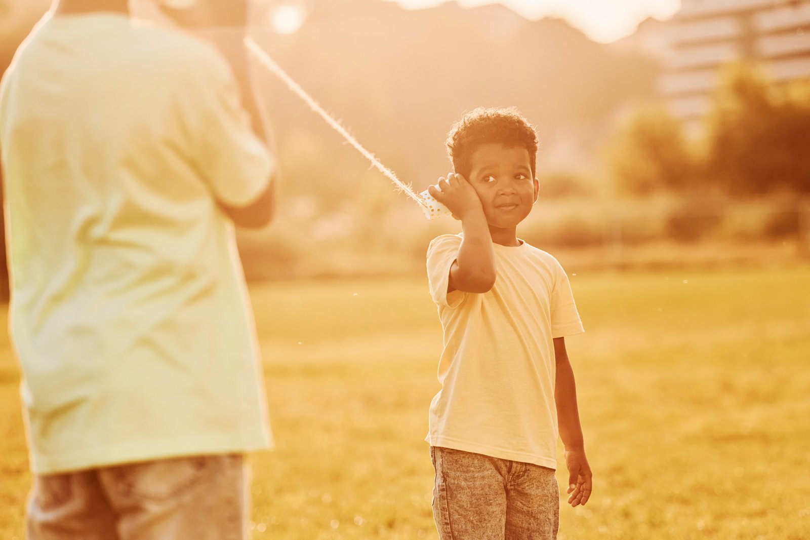 kids have fun in the field at summer daytime together.